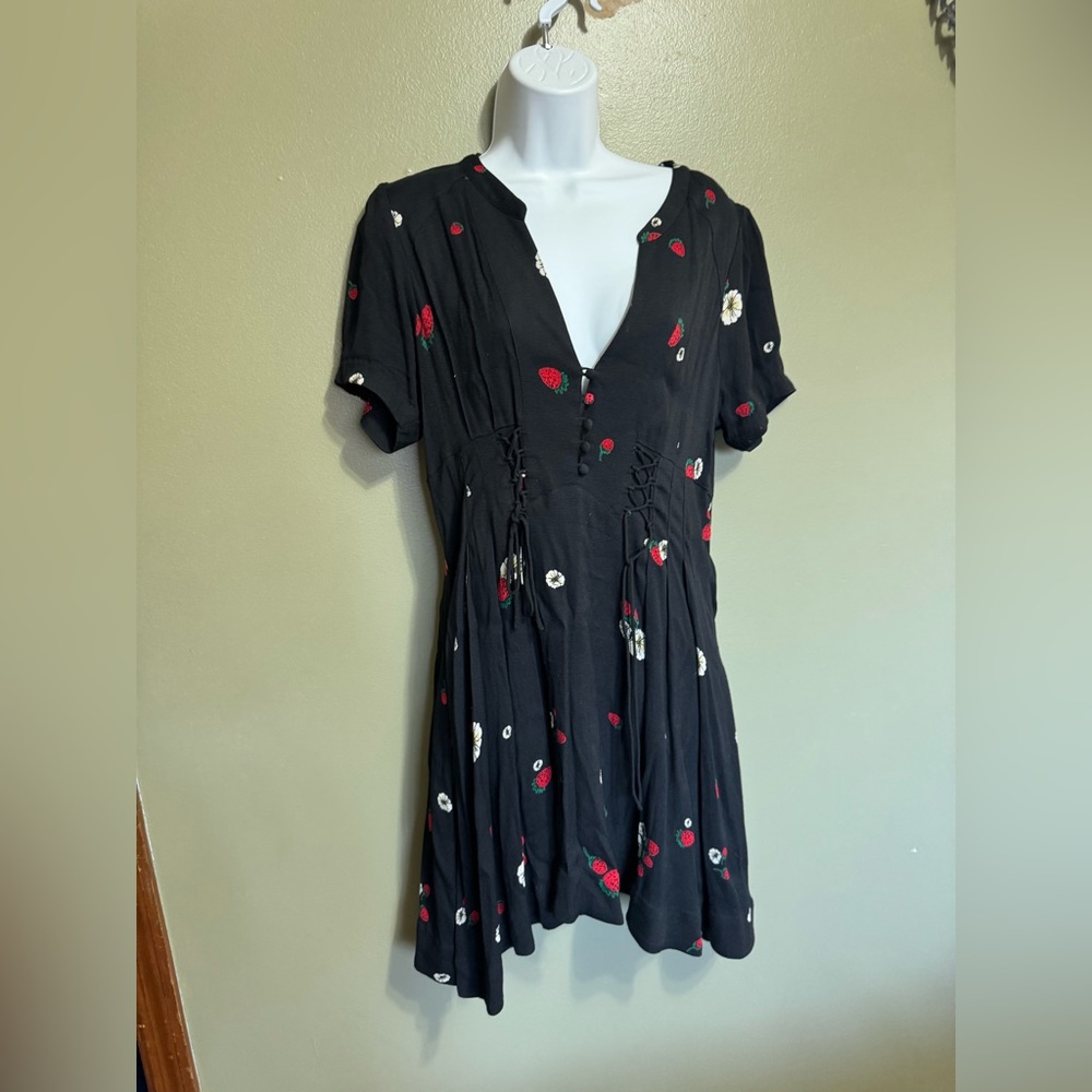 Free People Dream Girl mini dress in black with a‎ strawberry print. Size 8